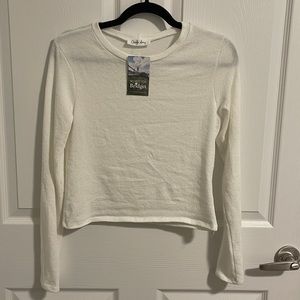 White long sleeve shirt in a soft woven fabric.